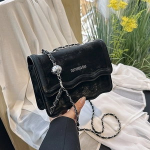 Chic black chain square shoulder bag with wavy flap and vintage texture finish