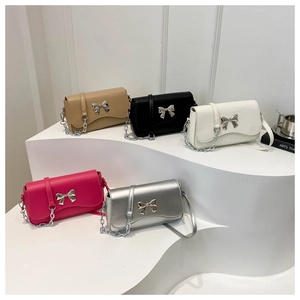 Selection of chic crossbody bags with metal bow accent in khaki, black, white, pink and silver