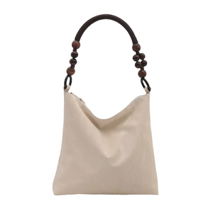 Chic cream velvet underarm bag with decorative brown wooden beads and retro style