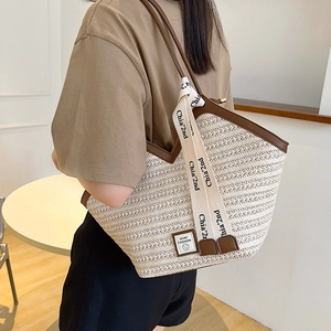 Off-white large capacity woven tote bag with brown trim and Sport Fashion logo