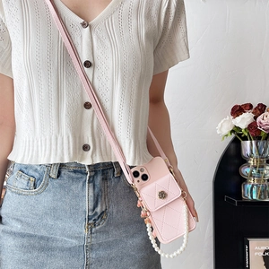 Pink quilted iPhone case with crossbody strap, metal camellia wallet, and pearl handle