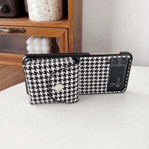 Detail of Samsung Galaxy Z Flip case featuring houndstooth wallet and silver button