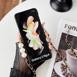 Elegant Galaxy Z Flip 4 black case with gold pearl chain and leather shoulder strap
