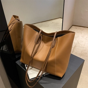 Retro tan leather tote bag with contrast stitching and long shoulder straps for women