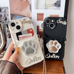 Detail of iPhone crossbody case with cat paw mirror, queen rhinestones and chain strap