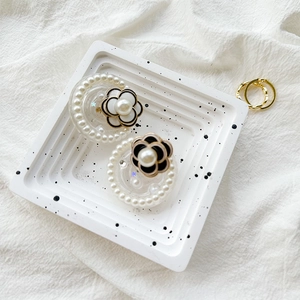 Elegant camellia pearl phone grip stand with shimmering rhinestones in a chic ins style