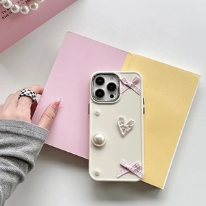 Cream iPhone case with pink plaid bows, pearls, and a silver Love heart charm for women