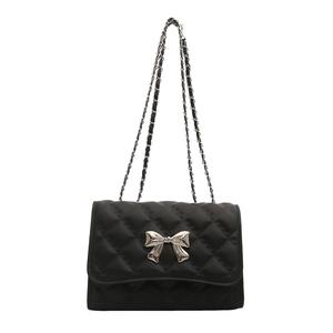 Sac bandoulière matelassé noir chic avec nœud argenté et chaîne élégante