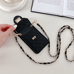 Close-up of black quilted crossbody phone case with gold twist lock and chain strap detail