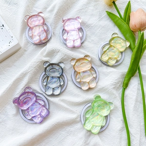 Detailed view of colorful laser bear phone grips in seven iridescent pastel resin colors