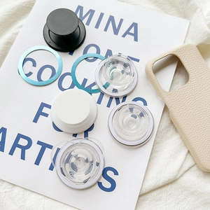 Close-up of magnetic phone sockets in various colors with a textured beige phone case
