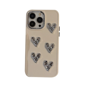 Cream phone case for iPhone 16 Pro with 3D silver electroplated metal heart patterns