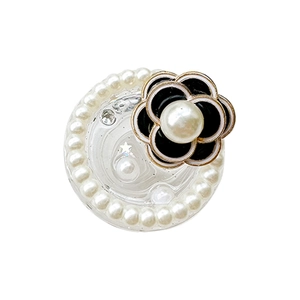 Cell phone air cushion stand with pearl camellia flower and star sequins on a white background