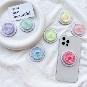 Colorful resin phone grips with macaron donut design and embedded pearl heart charms