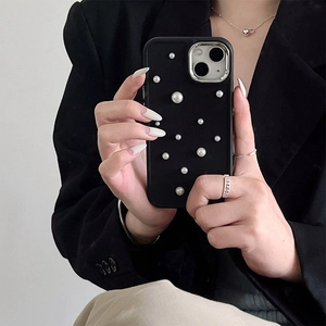 Detail of matte black iPhone case with white pearls and silver camera metal ring protector