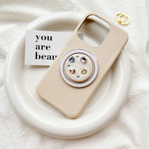Chic beige leather phone case featuring vibrant rhinestone crystal magnetic socket support