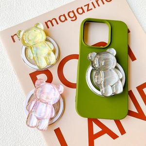 Detailed view of colorful laser-cut bear phone grips on a green silicone case