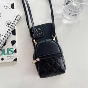 Detail of mini black quilted backpack phone case with golden zipper and strap for iPhone