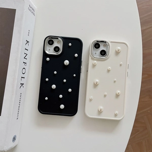 Luxury iPhone silicone case with 3D pearls and metal lens protection in black and cream