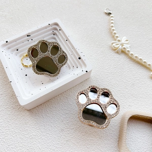 Detail view of cat paw phone grip with sparkling rhinestones and integrated makeup mirror