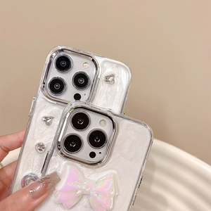 Detailed view of luxury iPhone case with pink holographic bow and crystal embellishments