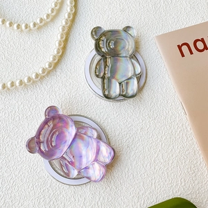 Detail of holographic bear pop socket stands in purple and grey with laser finish