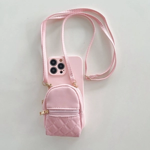 Close-up of pink crossbody iPhone case featuring a quilted mini backpack coin purse