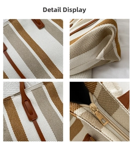 Detail shot of striped canvas tote bag showing weave texture and leather handle