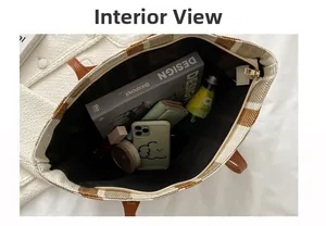Spacious interior of a striped tote bag with zipper closure and daily essentials inside