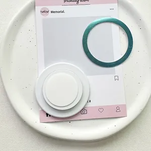 Close-up of a white collapsible phone socket with a teal electroplated magnetic ring