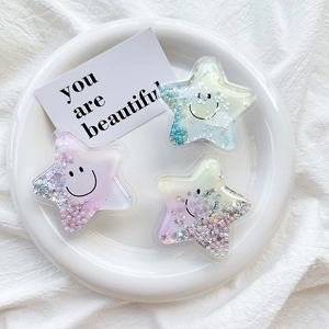 Detailed view of star-shaped phone sockets with colorful sequins and tiny pearls