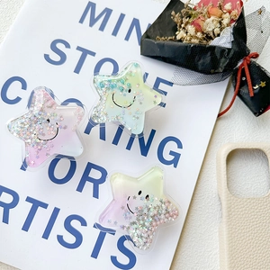 Detailed view of star-shaped phone sockets with colorful sequins and quicksand