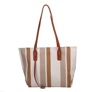 Vertical striped large capacity canvas tote bag with brown straps in a front view