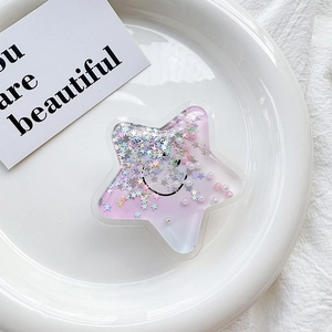 Detail of star-shaped phone grip with purple sequins, liquid glitter and a smiley face