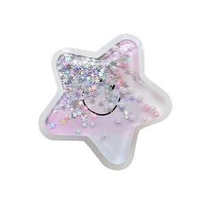 Pink star-shaped quicksand phone socket with colorful sequins and pearls on white background