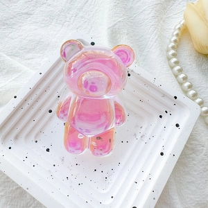 Macro view of a colorful iridescent 3D bear phone grip with glitter resin finish