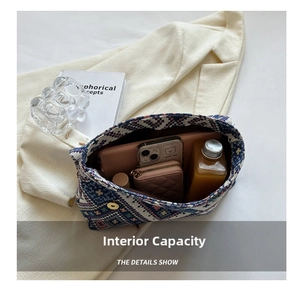Top view of the knit tote bag interior showing capacity for phone, wallet and cosmetics