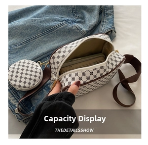 Detail view of the retro print crossbody bag interior showing spacious storage for phones