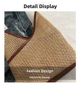 Detail view of woven straw bucket bag with brown leather trim and texture close-up