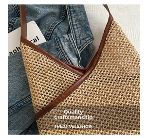 Close-up of woven straw texture with brown leather trim on a retro bucket bag