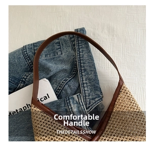 Close-up of handmade straw bucket bag featuring brown leather handles and woven texture