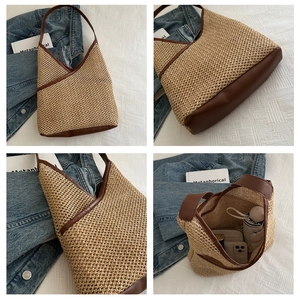 Detail of woven straw shoulder bag featuring brown leather trim and large interior capacity