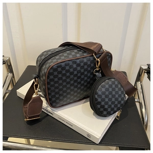 Detail of dark grey retro print crossbody bag with mini coin purse and wide strap