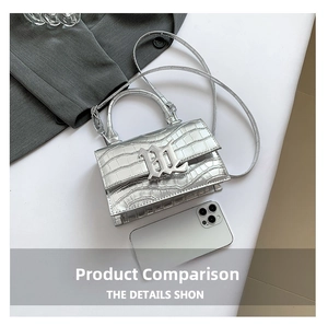 Detail shot of silver faux crocodile leather mini bag showing metallic texture and size