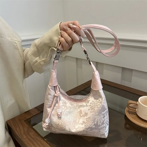 Pink jacquard bucket bag with traditional Chinese pavilion pattern and elegant bead charm