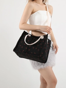 Black corduroy tote bag with red strawberry patterns and versatile crossbody strap