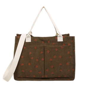 Brown corduroy tote bag with red strawberry print and dual strap handles for daily use