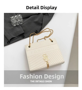 Detail of cream white crossbody bag with V-shaped quilting and elegant gold tassel charm