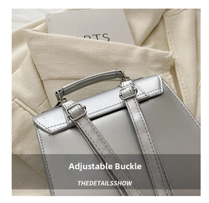 Close-up of adjustable metal buckle on silver leather backpack with strap detail
