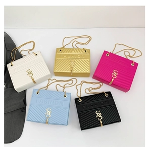 Group display of five colorful quilted chain handbags with gold tassel details
